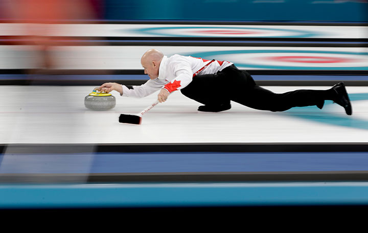 Canada's skip Kevin Koe throws a stone during a men's curling match against Japan at the 2018 Winter Olympics in Gangneung, South Korea, Feb. 20, 2018.