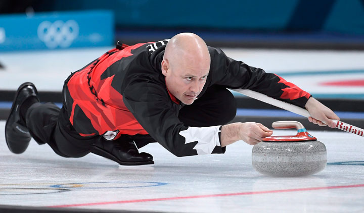 Canada skip Kevin Koe plays a stone during men's semifinal curling action against the USA at the 2018 Winter Olympics in Gangneung, South Korea, Thursday, Feb. 22, 2018. 