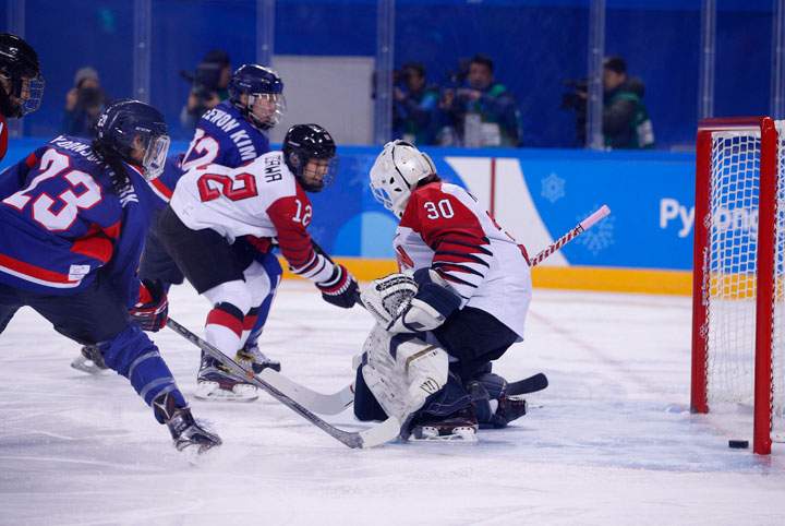 Randi Griffin of Korea scores against goalkeeper Akane Konishi of Japan.