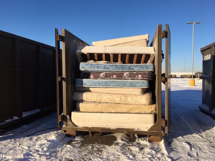 Mattresses sit at the Kennedale Eco Station before they are taken to the vendor for recycling.