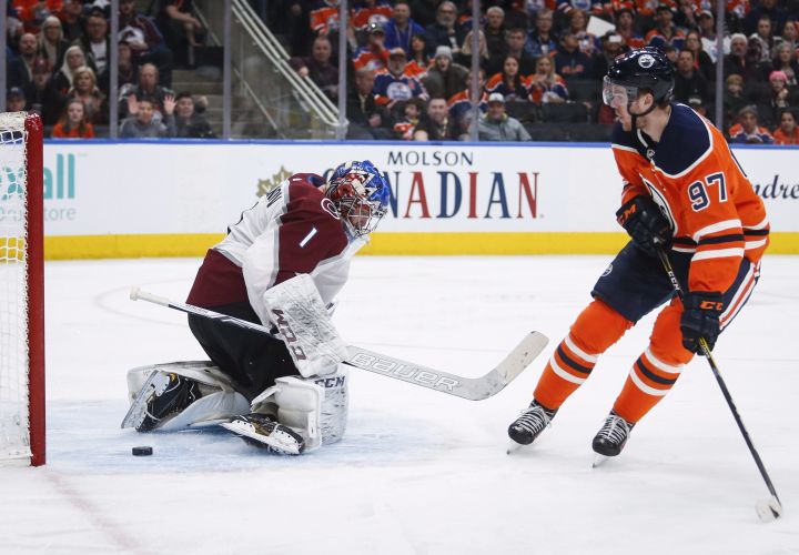 Colorado Avalanche goalie Semyon Varlamov, of Russia, stops a shot from Edmonton Oilers' Connor McDavid during second period NHL hockey action in Edmonton, Thursday, Feb. 22, 2018.