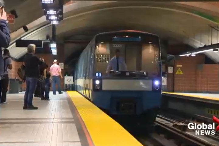 A train pulls into a Montreal Metro station. 