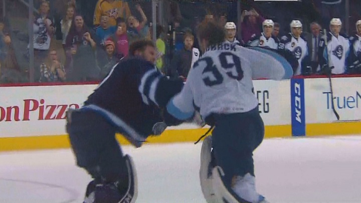 Manitoba Moose goalie Jamie Phillips fights Milwaukee Admirals goalie Anders Lindback after the final buzzer.