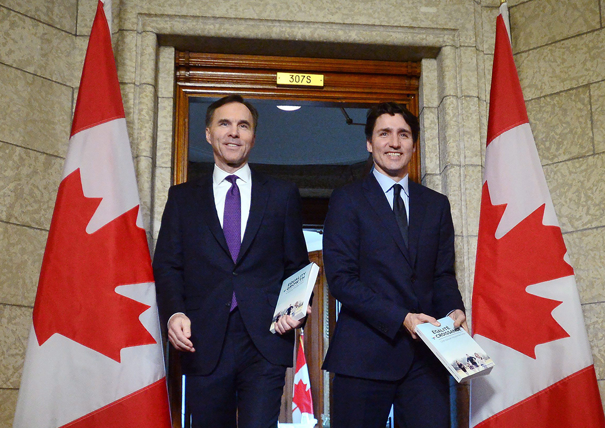 Bill Morneau and Justin Trudeau leave the prime minister's office to table the federal budget in the House of Commons in Ottawa on Tuesday, Feb.27, 2018. 