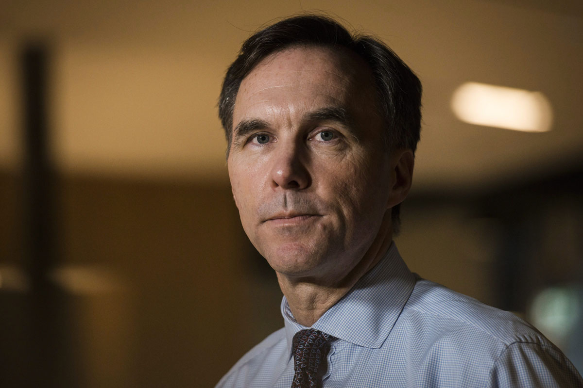 Minister of Finance Bill Morneau speaks to media after meeting with private sector economists, in Toronto on Friday, February 16, 2018.