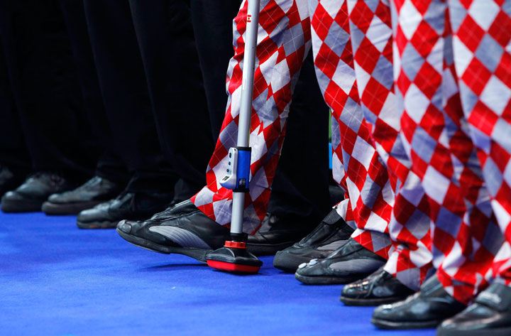 Team Norway, right, with their stylish chequered curling pants stand next to Team Canada, during Olympic men’s curling finals action at the Olympic Centre on Saturday, Feb. 27, 2010 during the 2010 Vancouver Olympic Winter Games in Vancouver.