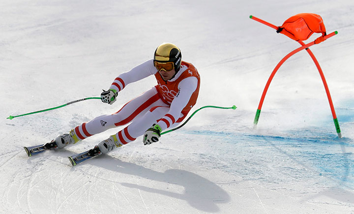 Austria’s Hannes Reichelt makes a turn during men’s downhill training at the 2018 Winter Olympics in Jeongseon, South Korea, Feb. 10, 2018.