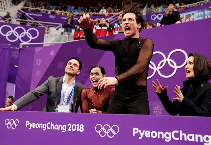 Canada’s Tessa Virtue and Scott Moir react after winning the gold in the ice dance competition in Gangneung, South Korea, Feb. 20, 2018. 