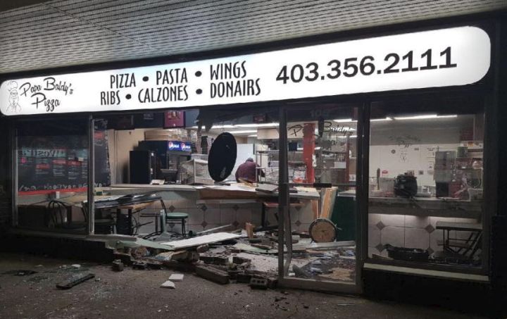 The RCMP are investigating what prompted the driver of a pickup truck to reverse across a Red Deer parking lot and smash into a pizzeria, injuring an employee and causing "very extensive damage" to the restaurant on Thursday night.