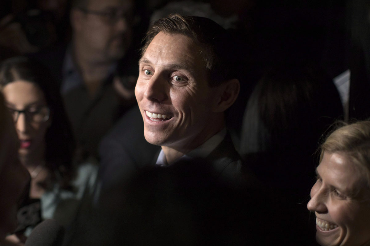 Patrick Brown scrums with reporters after addressing supporters and the media in Toronto on Sunday, Feb. 18.