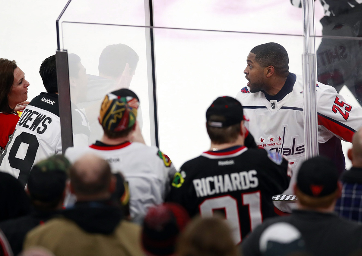 Washington Capitals right wing Devante Smith-Pelly (25) argues with Chicago Blackhawks fans from the penalty box during the third period of an NHL hockey game Saturday, Feb. 17, 2018, in Chicago. 