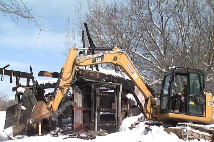 Heavy machinery was brought in on Tuesday to rip down the remains of the structure.
