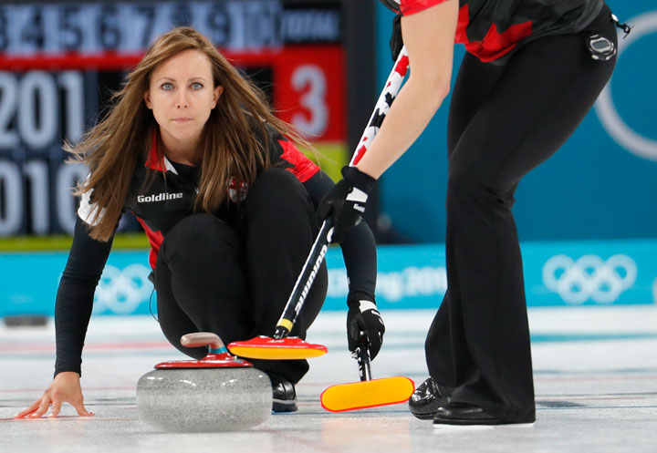 Skip Rachel Homan of Canada delivers the stone in a game against Sweden. 
