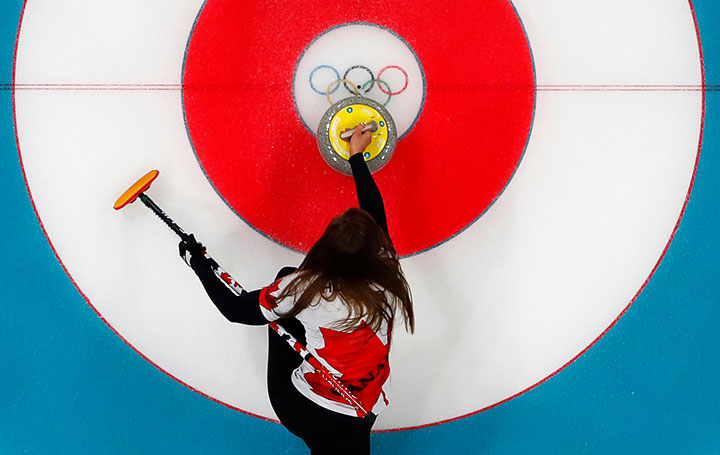 Canada’s skip Rachel Homan delivers a stone during round robin action on Feb. 19, 2018 in Gangneung, South Korea. 