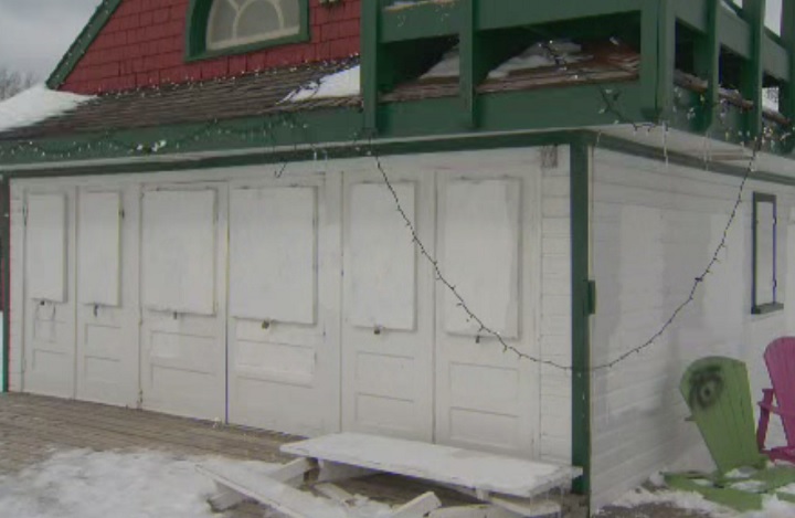 White paint covers the racist graffiti on the Leuty Lifeguard Station in Toronto on Feb. 13, 2018.