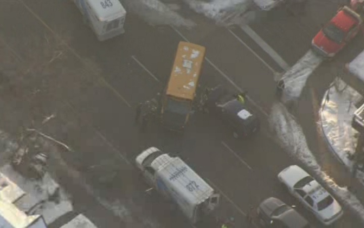 Emergency crews respond to the scene of a school bus crash in Toronto on Feb. 14, 2018.