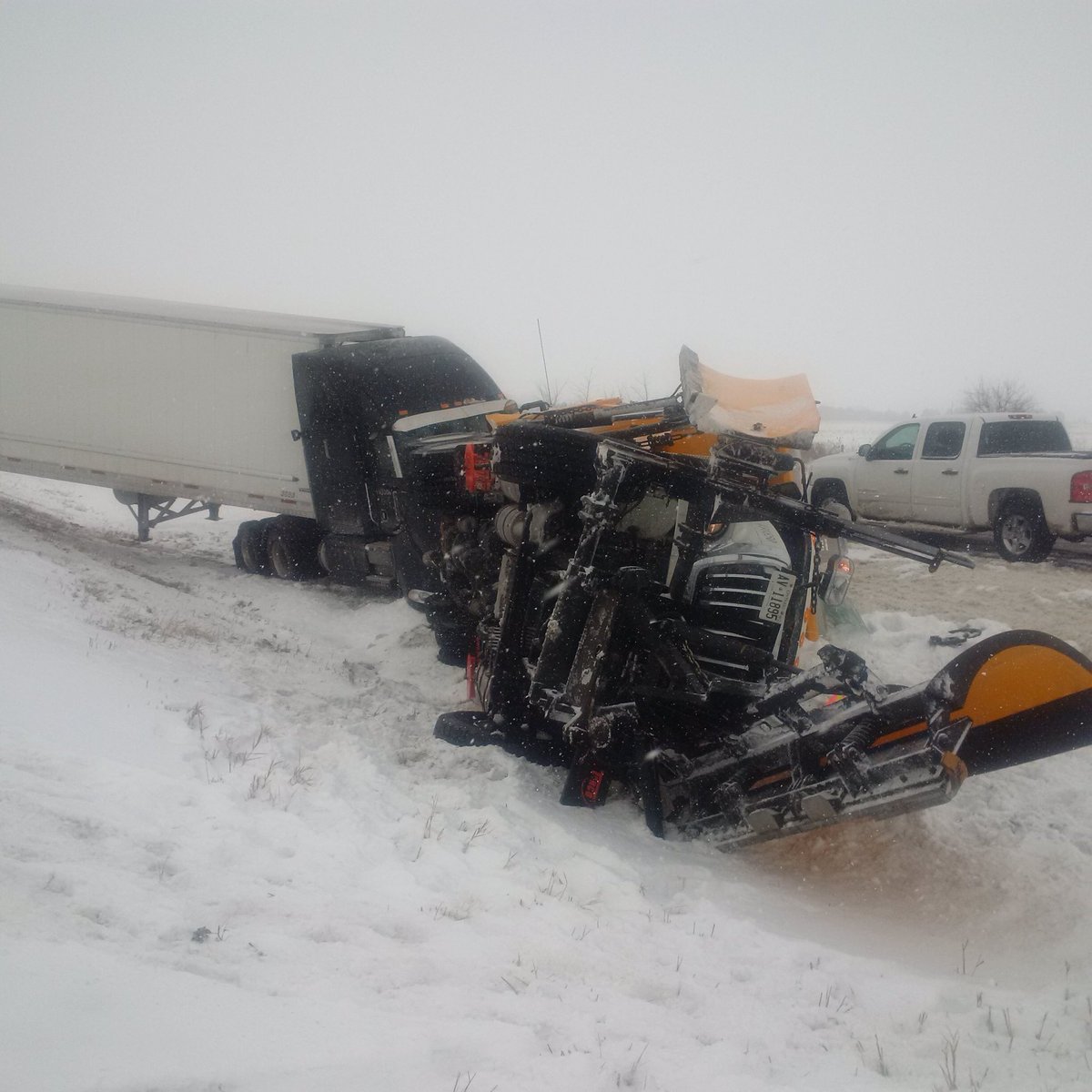 A transport truck driver has been charged following a crash with a snow plow on Feb. 9, 2018.