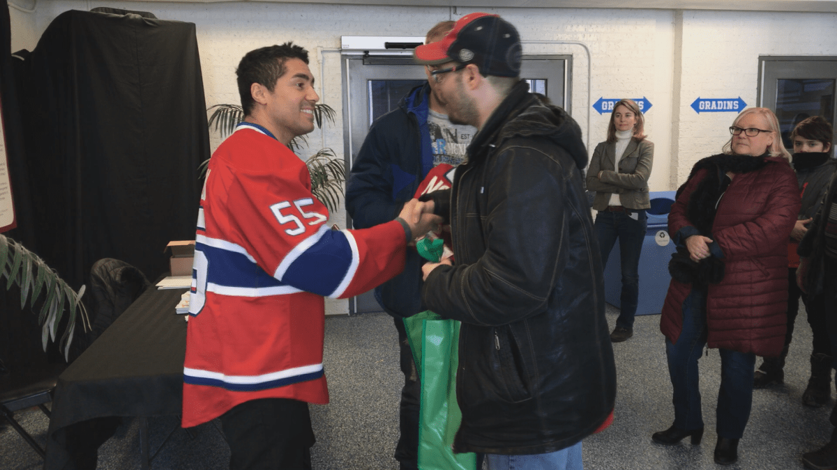 Former Montreal Canadien, Francis Bouillon, greeting fans at the Francis-Bouillon arena on Sunday, February 18, 2018.