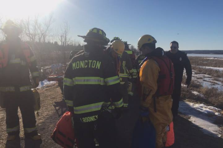 Emergency crews are seen here during the water rescue of a man on the Petitcodiac River on Thursday. RCMP in New Brunswick now say that the man they were attempting to help had just fled from the scene of an assault.