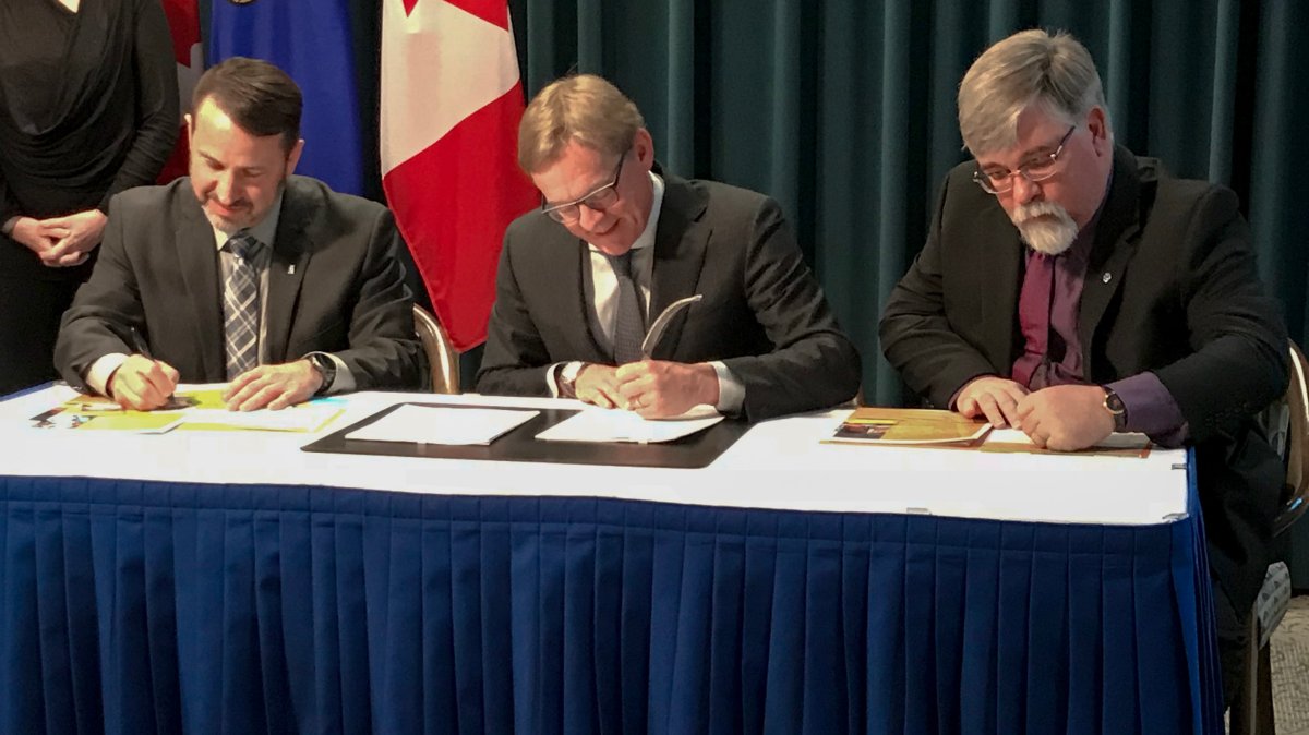 Education minister David Eggen signs Professional Practice Standards with Michael Hauptman from the College of Alberta School Superintendents and Greg Jeffery from the Alberta Teachers’ Association.