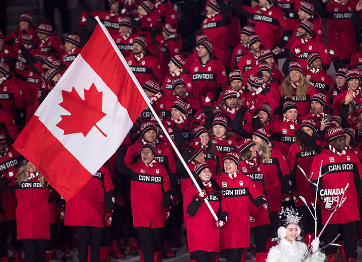 Team Canada members walk into the Olympic stadium during the opening ceremony of the 2018 Winter Olympic Games in Pyeongchang, South Korea, Feb. 9, 2018.