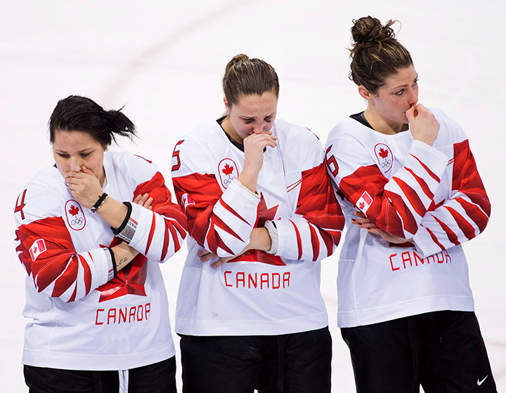 Canada’s Brigette Lacquette, left to right, Lauriane Rougeau and Rebecca Johnston react after losing to the United States in shootout women’s gold medal final at the 2018 Olympic Winter Games in Gangneung, South Korea, Feb. 22, 2018.