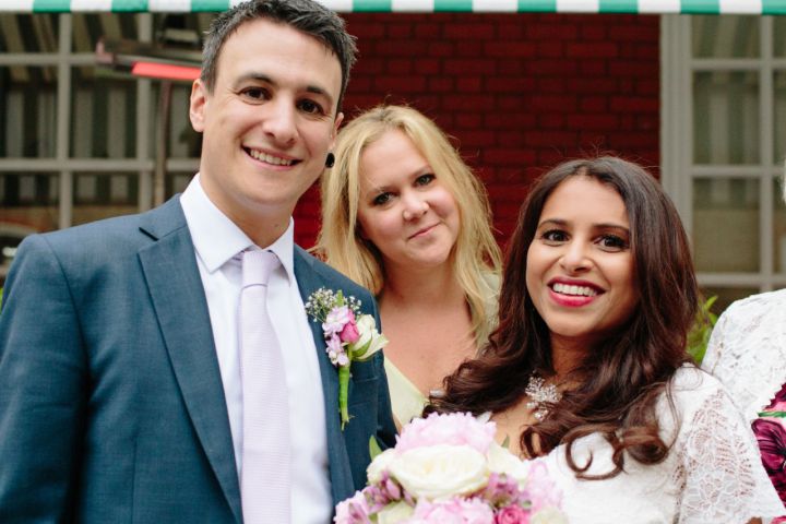 Comedian Amy Schumer photobombs newlyweds Jasmin Pereira and Jon Bates’ wedding photo in London. The couple will definitely cherish this moment forever. Photo: Shutterstock