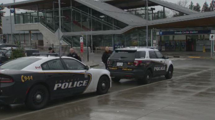 Transit Police are seen outside Moody Centre SkyTrain station in this undated file photo. 