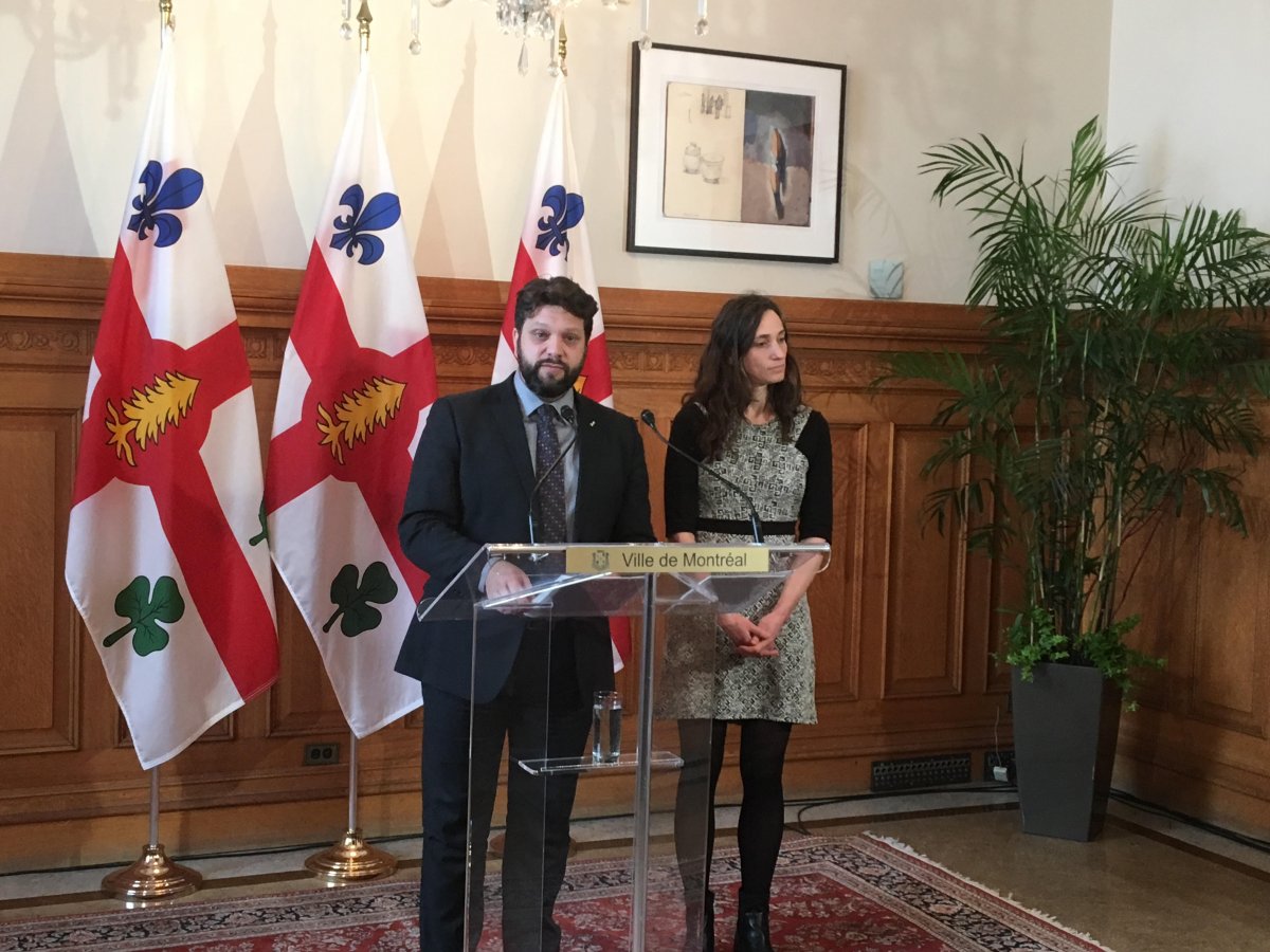 City councillors Eric Alan Caldwell and Marianne Giguere talk road safety proposals at Montreal city hall on Feb. 14, 2018.