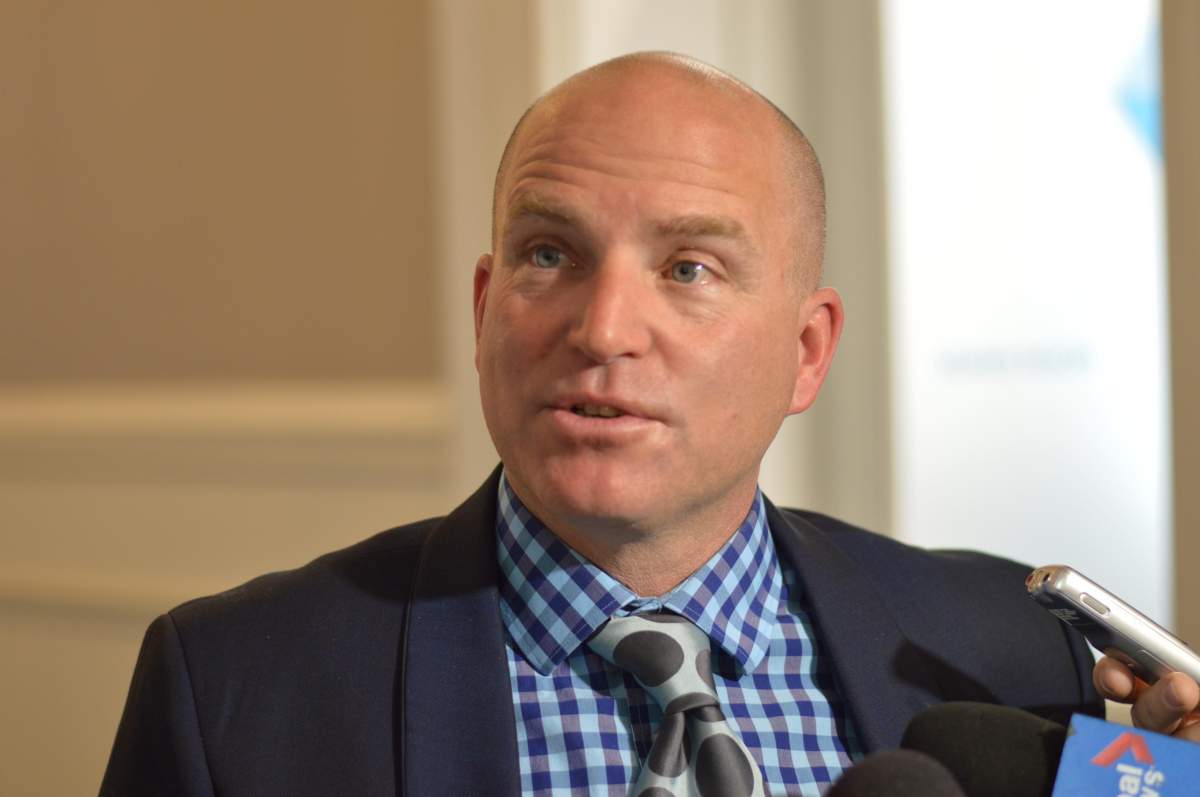 Councillor Matt Whitman speaks with media on Feb. 27, 2018.