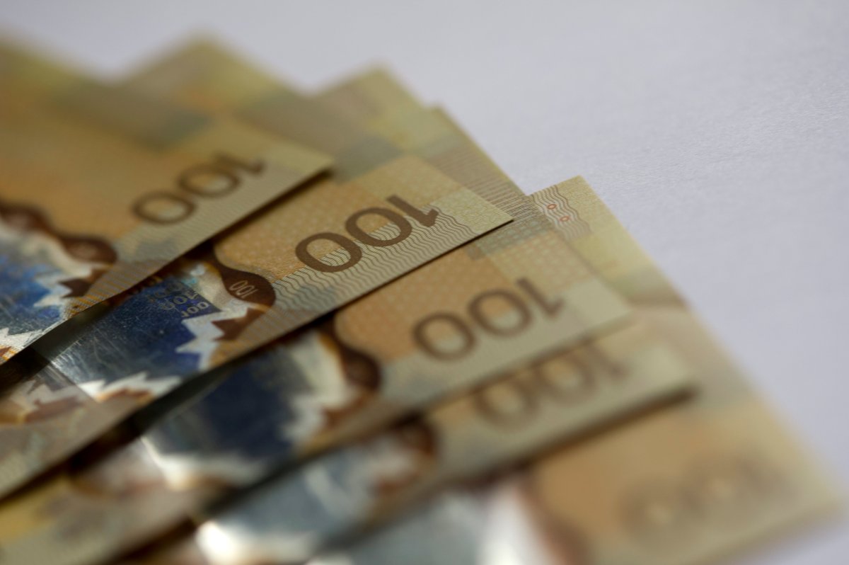 A file photo showing Canadian $100 bills.
