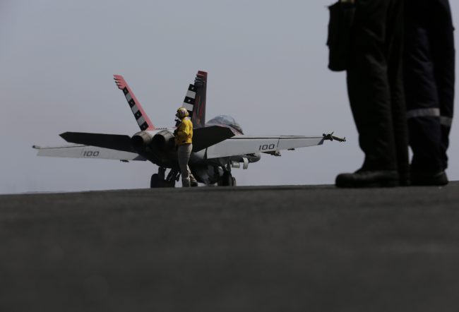 A U.S. military plane takes off from the flight deck of the USS Carl Vinson aircraft carrier in the Persian Gulf, Thursday, March 19, 2015. 


