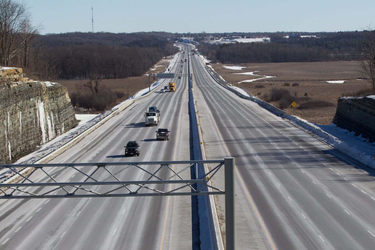 Cars and trucks drive along a stretch of highway 401 in Kingston, Ont., in a 2016 file photo.