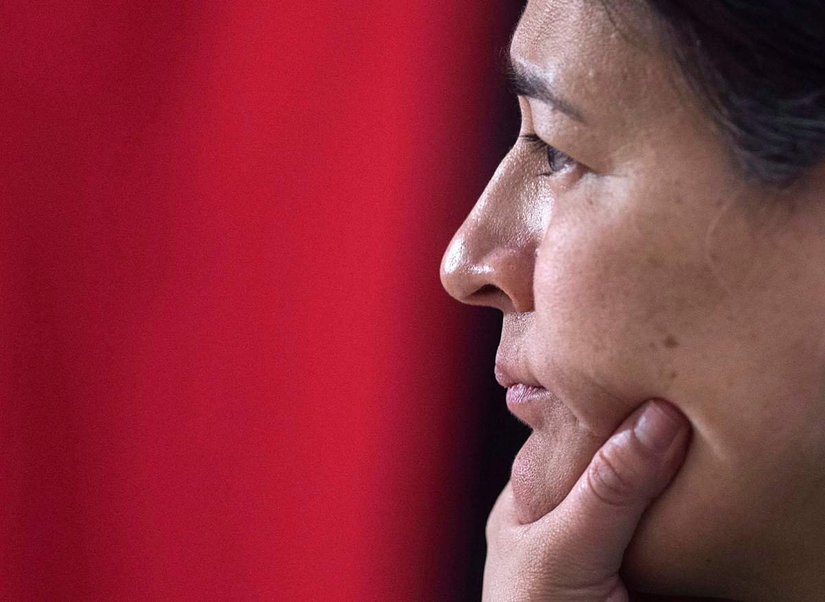 File - Michele Audette, one of the commissioners of the National Inquiry into Missing and Murdered Indigenous Women and Girls, listens as Pamela Fillier testifies about the death of her 16-year-old daughter, Hilary Bonnell, in Moncton, N.B. on Tuesday, Feb. 13, 2018. 