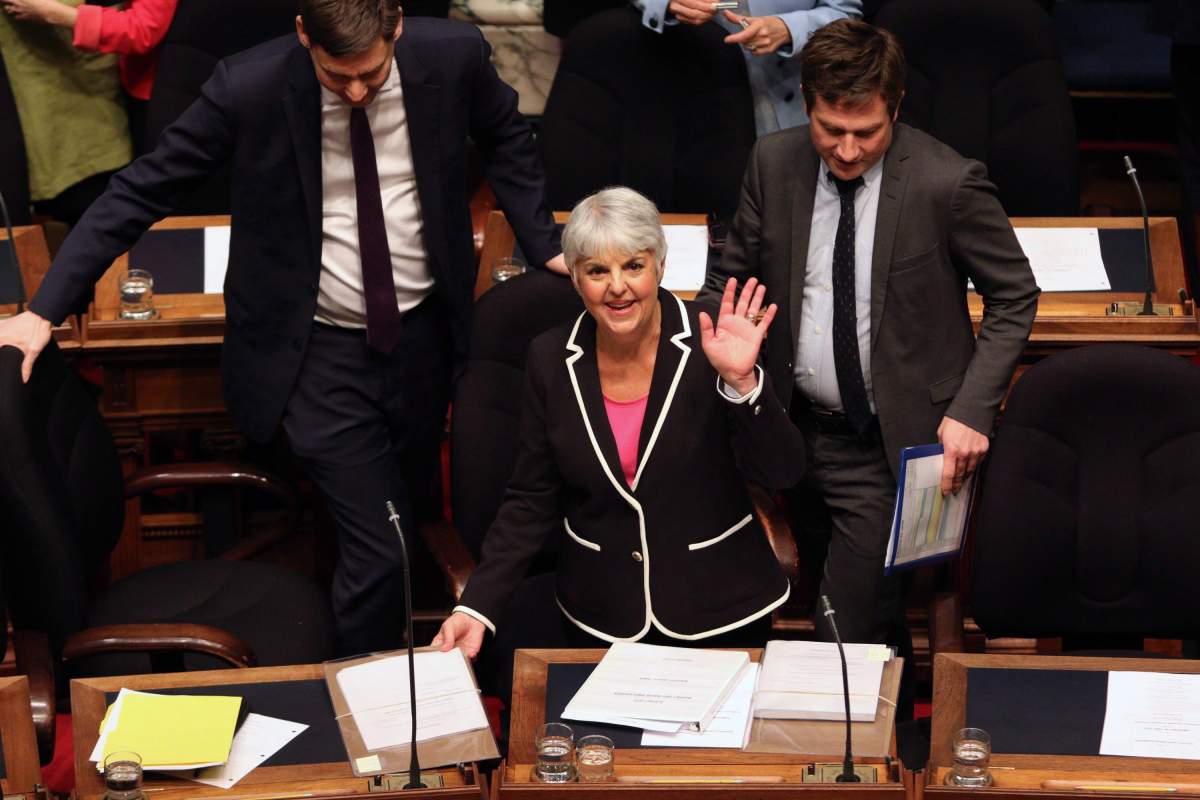 Finance Minister Carole James waves to her husband Albert Gerow before delivering the budget speech from the legislative assembly at Legislature in Victoria, B.C., on Tuesday, February 20, 2018. 