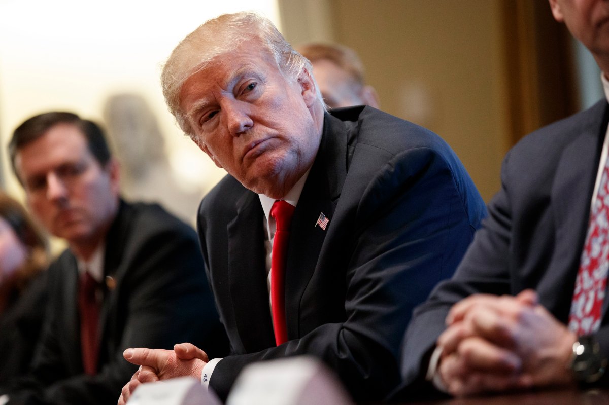 President Donald Trump listens during a meeting with steel and aluminum executives in the Cabinet Room of the White House, Thursday, March 1, 2018, in Washington.