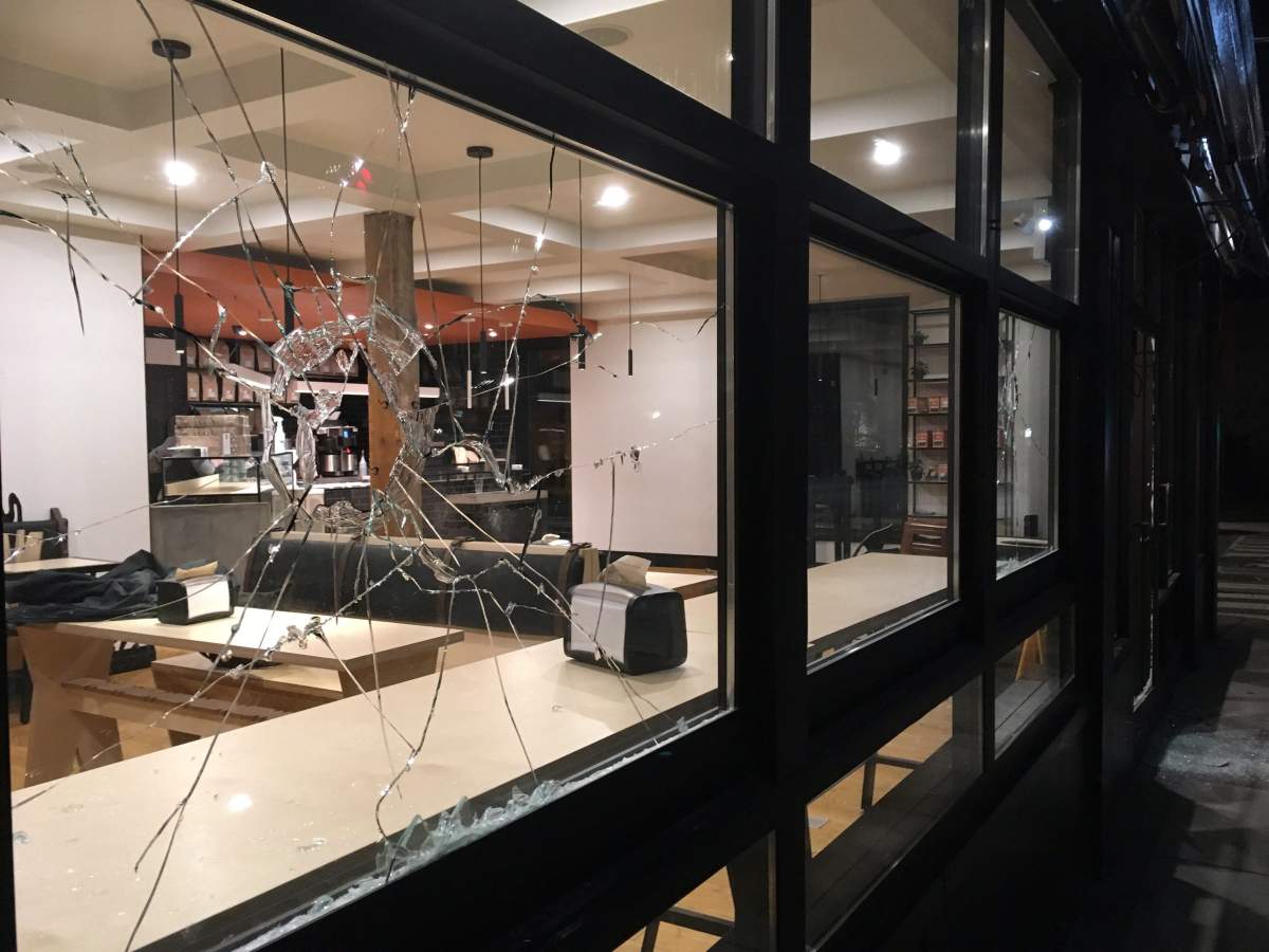  A broken window is seen at Donut Monster, in Hamilton on Saturday, March 3, 2018. 