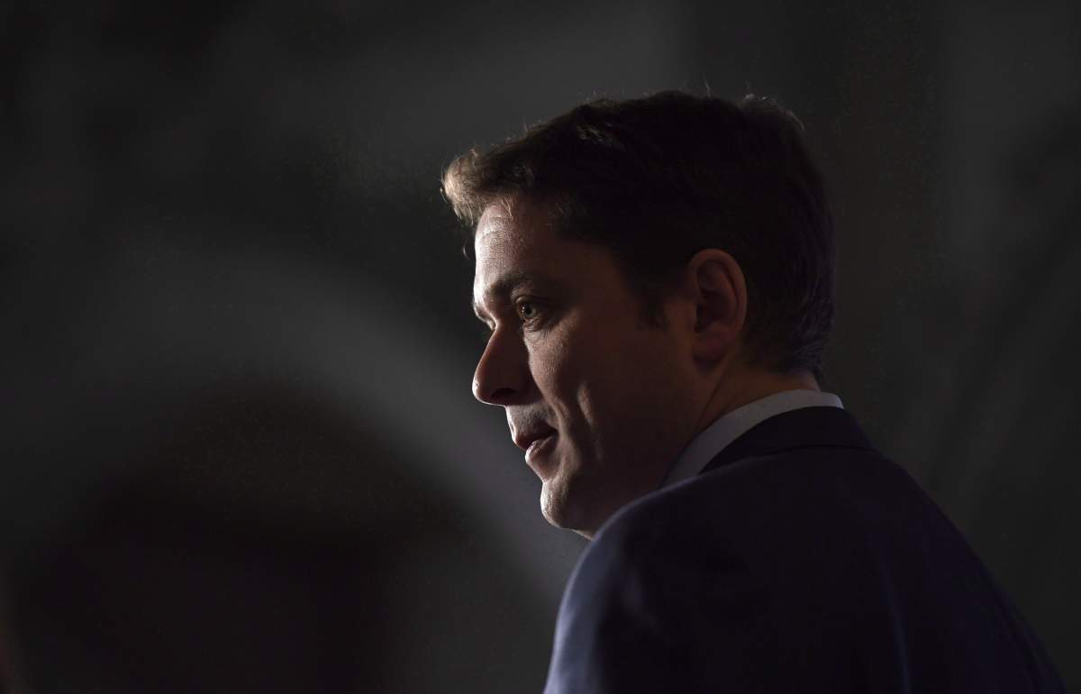 Conservative Leader Andrew Scheer speaks to reporters during a media availability on Parliament Hill in Ottawa on Tuesday, Feb. 6, 2018. Scheer is off to London to start laying the groundwork for his pledge to negotiate a free trade agreement with the United Kingdom should he become prime minister.