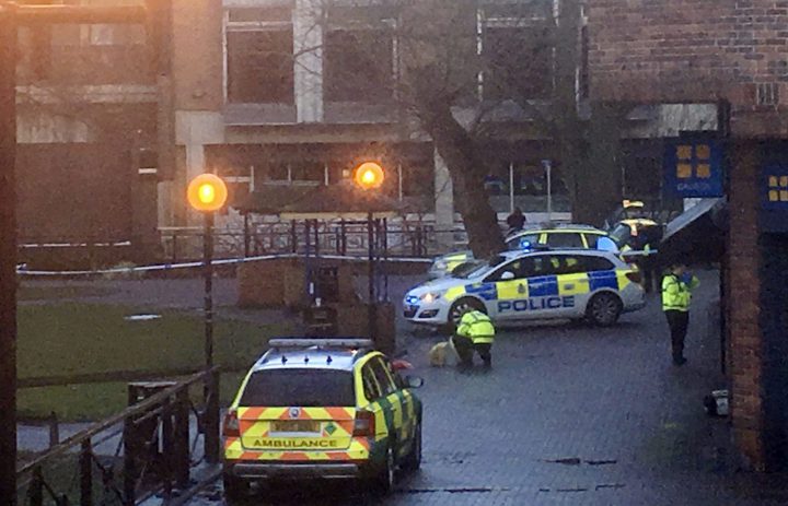 Police officer next to the bench where Sergei Skripal and his daughter Yulia were found in Salisbury, England, on March 4, 2018.