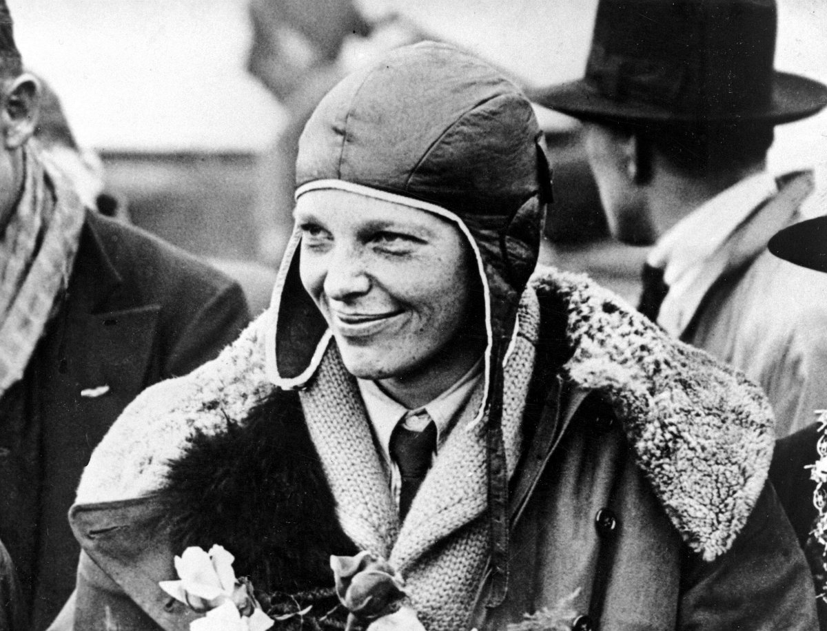 In a June 26, 1928 file photo, American aviatrix Amelia Earhart poses with flowers as she arrives in Southampton, England, after her transatlantic flight on the "Friendship" from Burry Point, Wales.