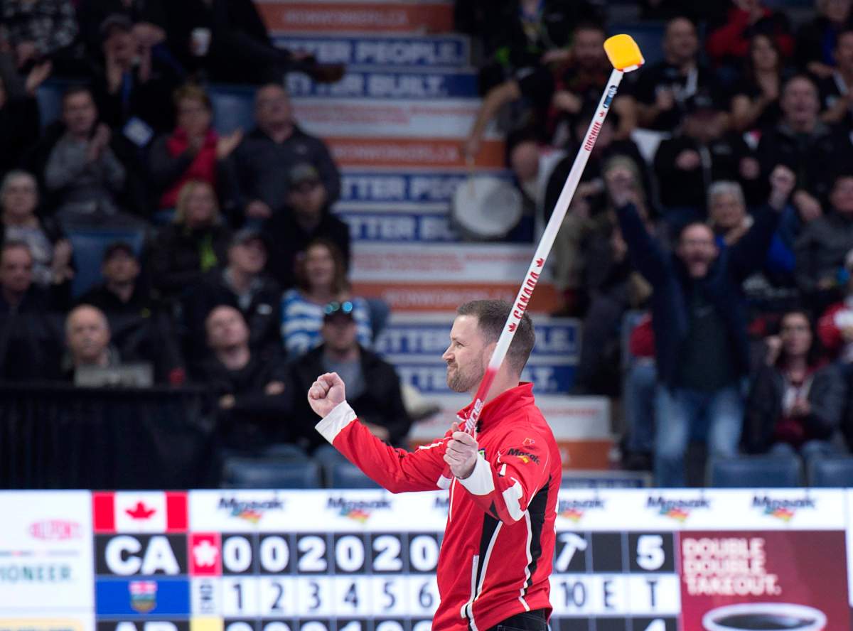 Team Canada skip Brad Gushue celebrates after defeating Alberta 6-4 to win the Tim Hortons Brier at the Brandt Centre in Regina on Sunday, March 11, 2018.