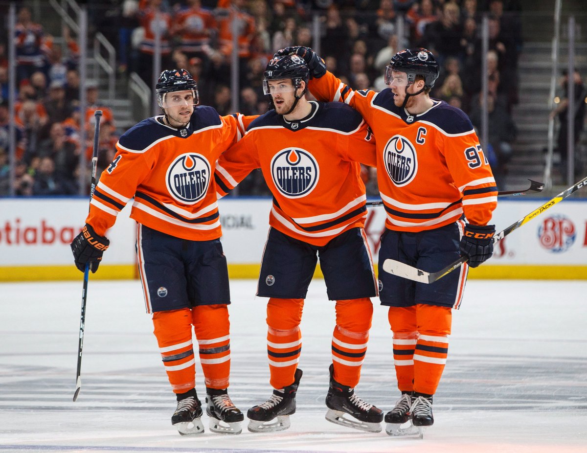 Edmonton Oilers defenceman Kris Russell (4), defenceman Oscar Klefbom (77) and centre Connor McDavid (97) celebrate a goal against the San Jose Sharks during second period NHL action in Edmonton, Alta., on Wednesday March 14, 2018. 
