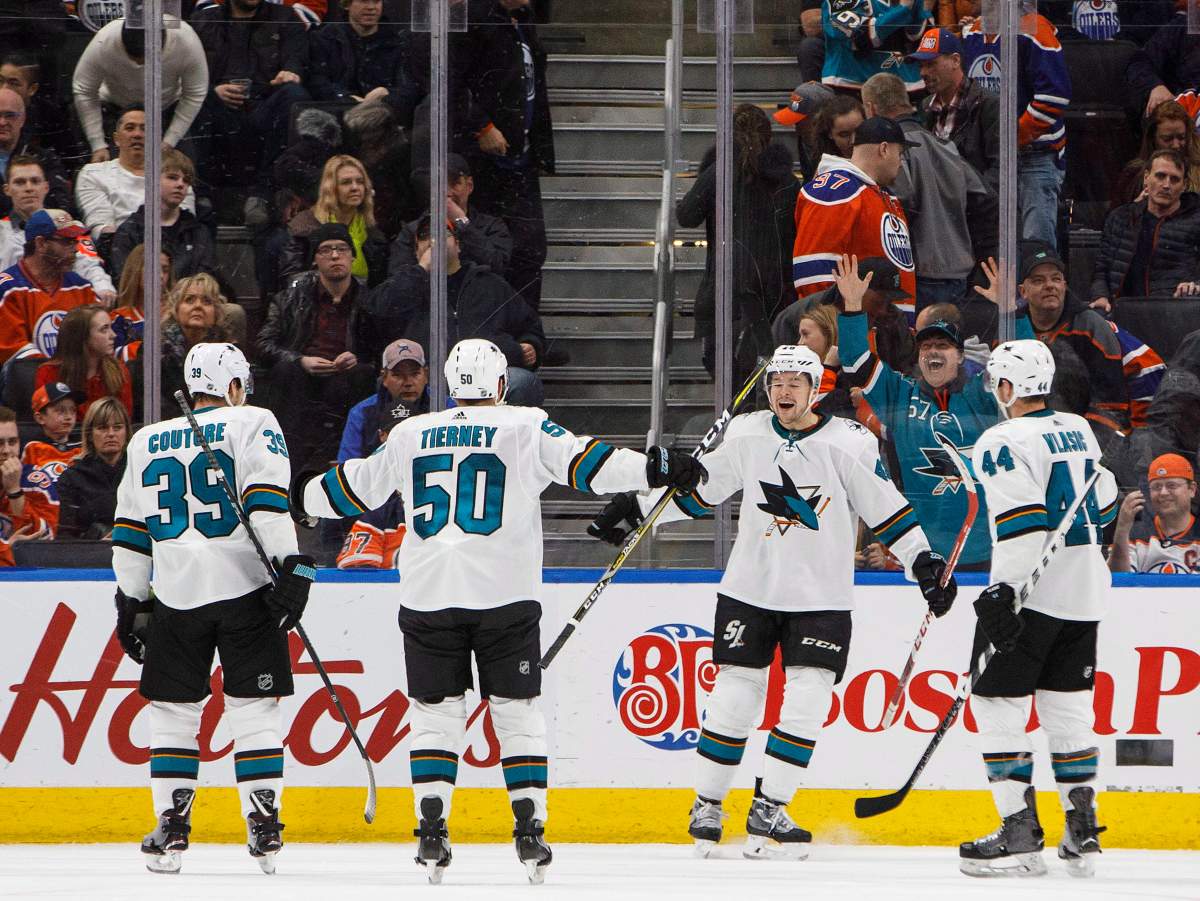San Jose Sharks centre Logan Couture (39), centre Chris Tierney (50), centre Tomas Hertl (48) and defenceman Marc-Edouard Vlasic (44) celebrate the overtime goal against the Edmonton Oilers during NHL action in Edmonton, Alta., on Wednesday March 14, 2018.