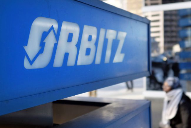 This Feb. 12, 2015 file photo shows signage for travel booking site Orbitz outside the building that houses its headquarters, in Chicago.