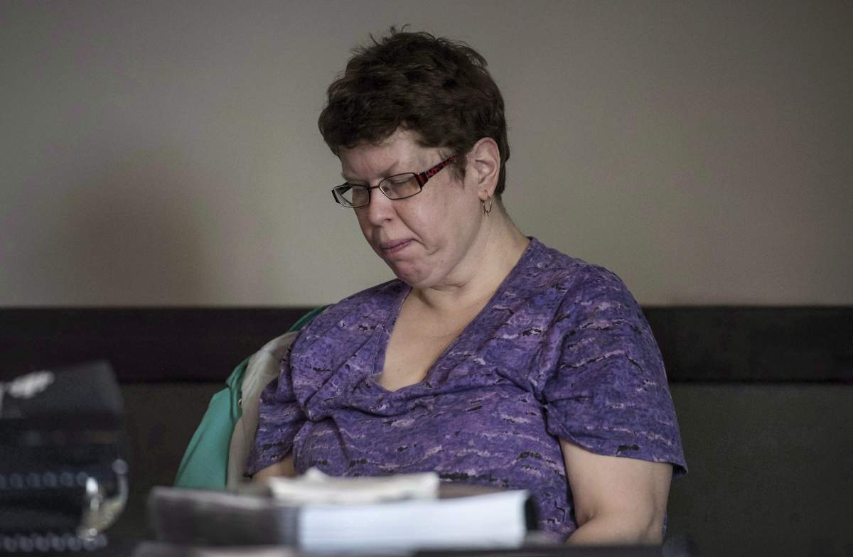 Beth MacLean, the woman at the centre of a human rights case dealing with persons with disabilities and their attempts to move out of institutions, pauses while testifying at an inquiry in Halifax on Tuesday, March 6, 2018. 