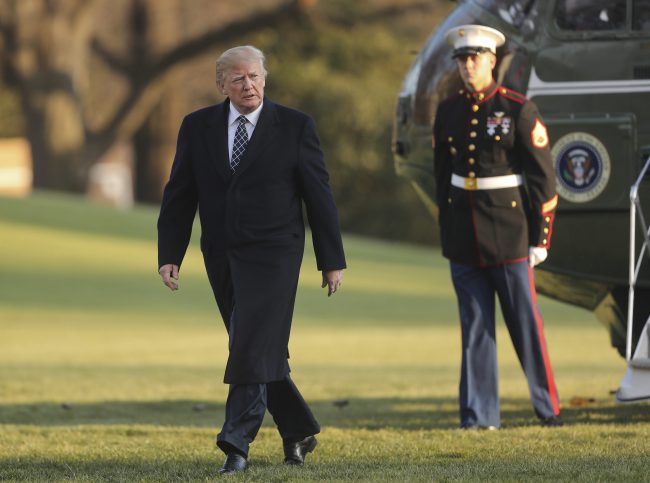 U.S. President Donald Trump walks across the South Lawn of the White House in Washington, Sunday, March 25, 2018, after returning from his Mar-a-Lago estate in Palm Beach, Fla.