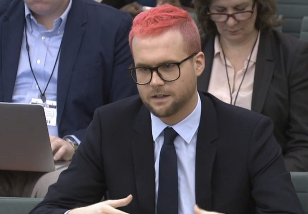 In this image taken from video, Chris Wylie gives evidence to a British House of Commons committee's inquiry into fake news, March 27, 2018. 