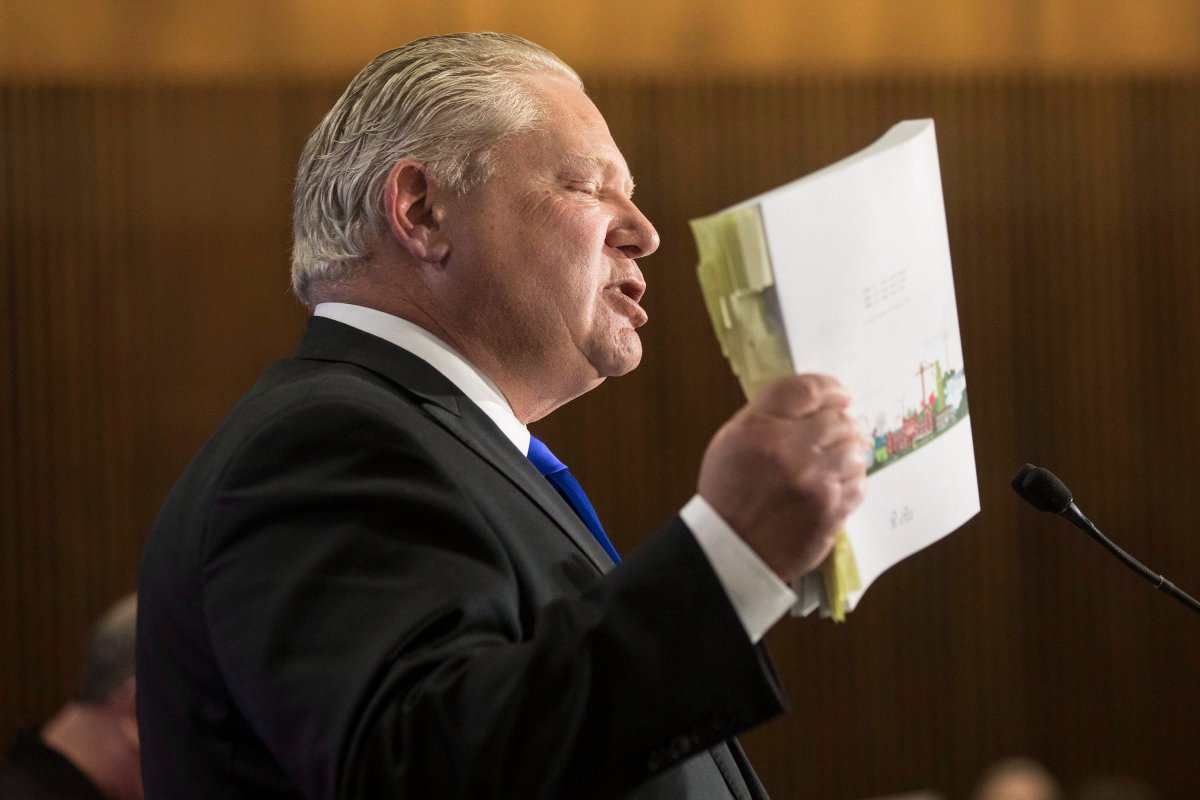 Ontario PC Leader Doug Ford waves a copy of the Provincial Budget as he takes questions from journalists, during a pre-budget lock-up, as the Ontario Provincial Government prepares to deliver its 2018 Budget , at the Queens Park Legislature in Toronto, on Wednesday,March 28, 2018.