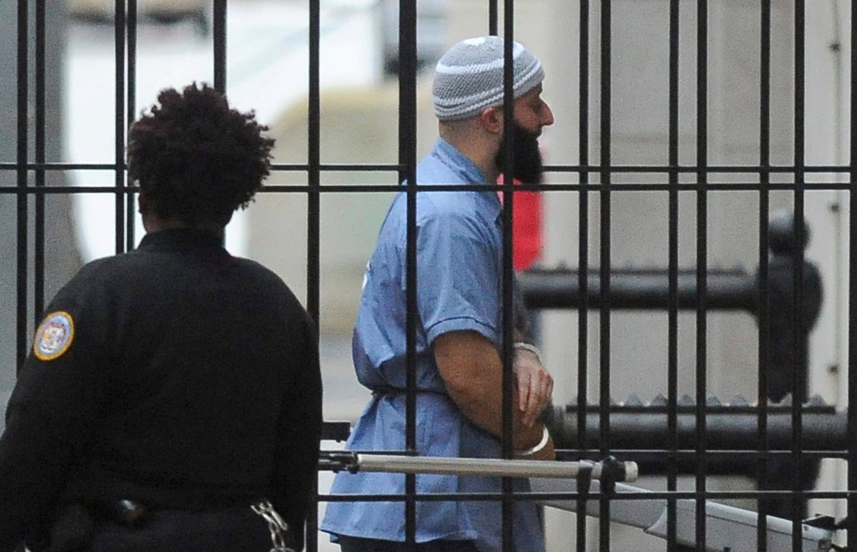 FILE - In this Feb. 3, 2016 file photo, Adnan Syed enters Courthouse East in Baltimore prior to a hearing.    A Maryland appeals court has upheld a ruling, Thursday, March 29, 2018,  granting a new trial to Syed, whose conviction in the murder of his high school sweetheart became the subject of the popular podcast "Serial." Syed was convicted in 2000 of killing Hae Min Lee and burying her body in a shallow grave in a Baltimore park. A three-judge panel on Thursday upheld a lower court ruling granting him new trial.(Barbara Haddock Taylor/The Baltimore Sun via AP).