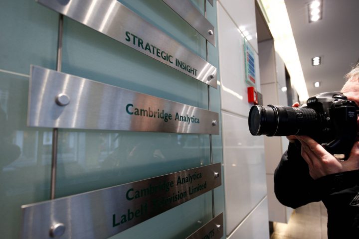 A photographer takes a photograph of the nameplate of political consultancy, Cambridge Analytica,  in central London, Britain March 21, 2018.   